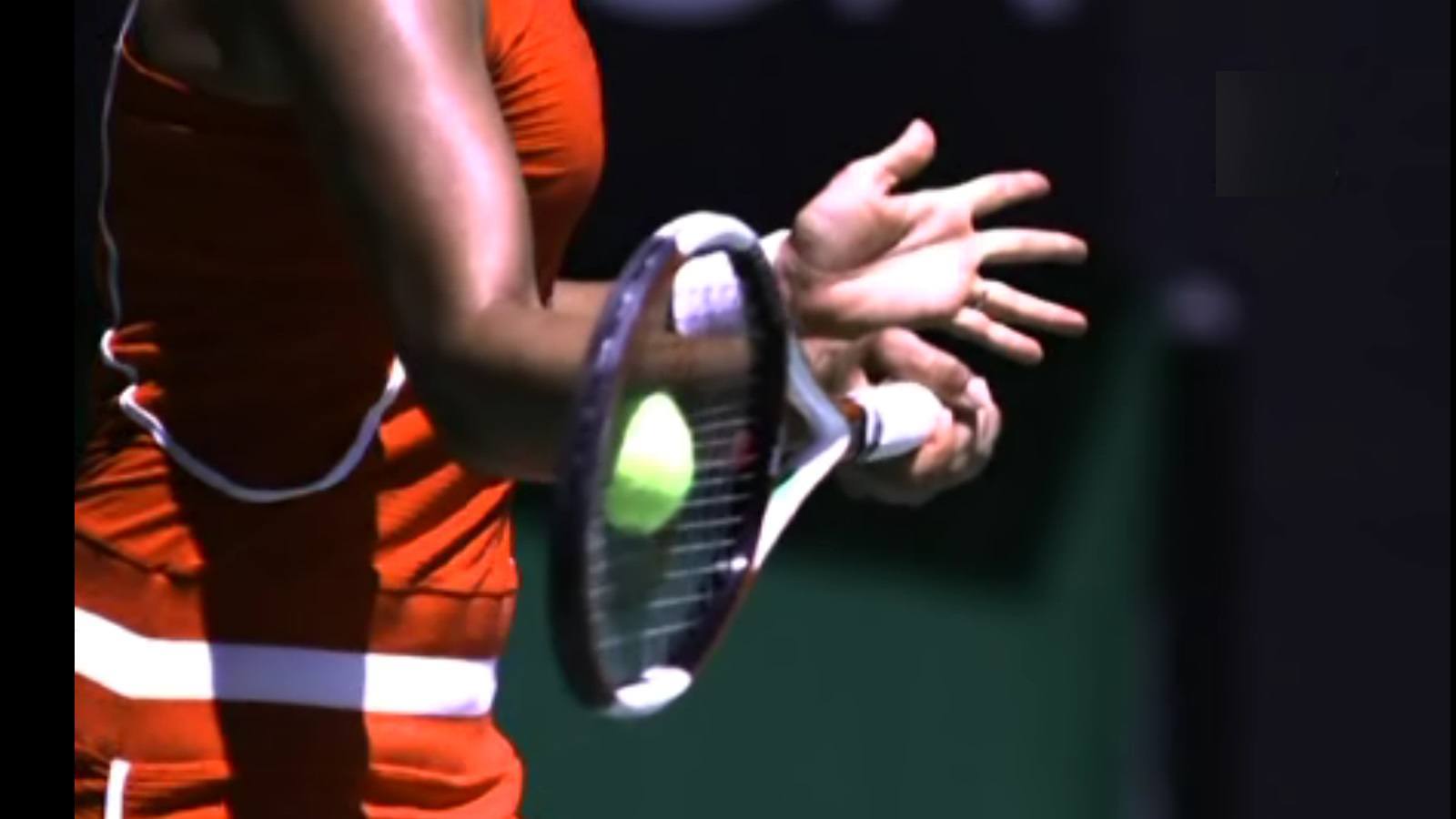 hitting a tennis ball