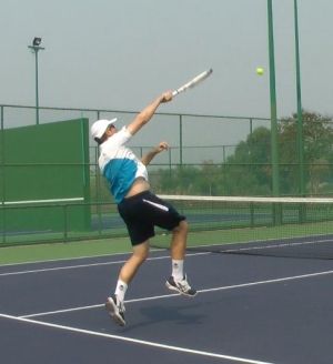 overhead-backwards tennis overhead while moving