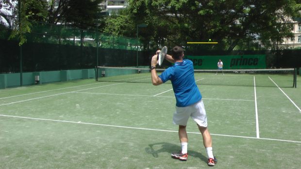 high-forehand-baseline forehand high above the net