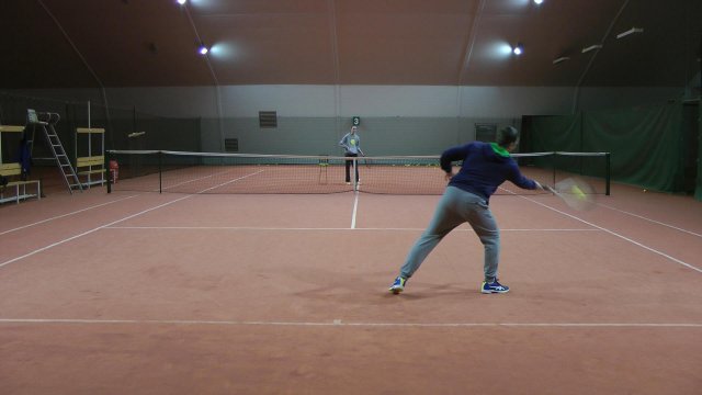 forehand-reaching reaching for a tennis ball