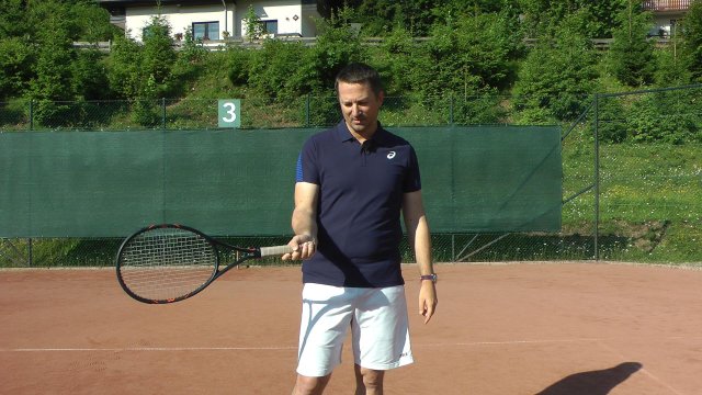 hand-handle hand on a tennis handle