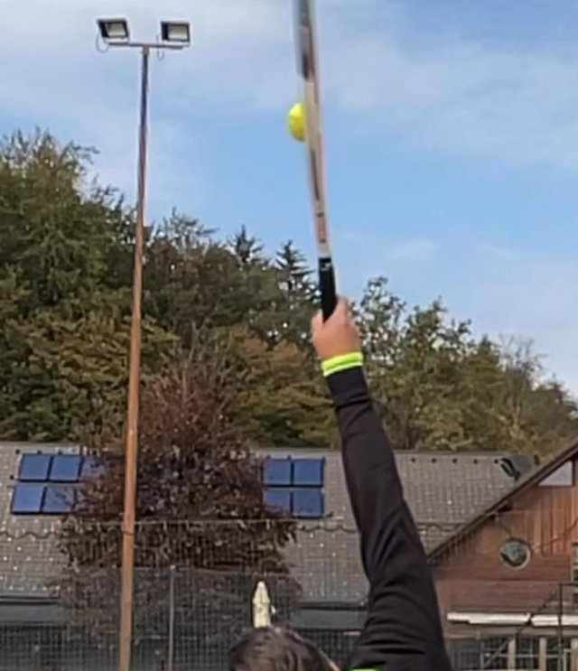 wrist-contact wrist at contact on topspin serve