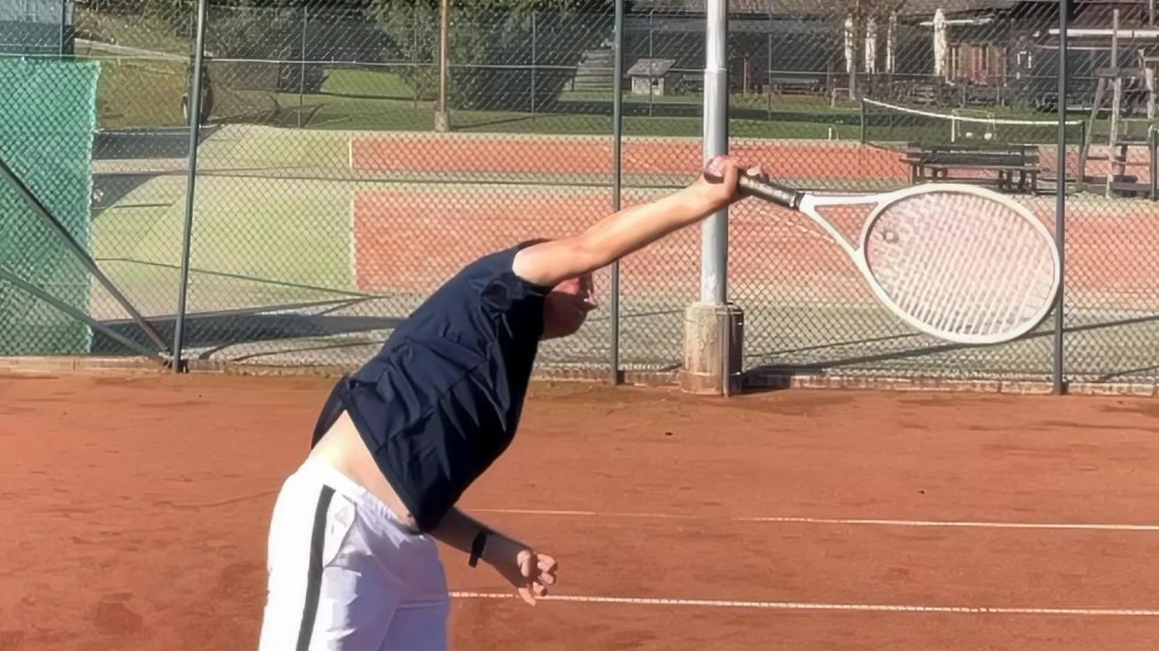 tennis serve wrist snap illusion